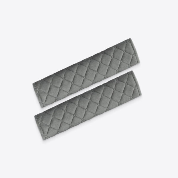 Gray soft patterned seat belt strap covers on car seats