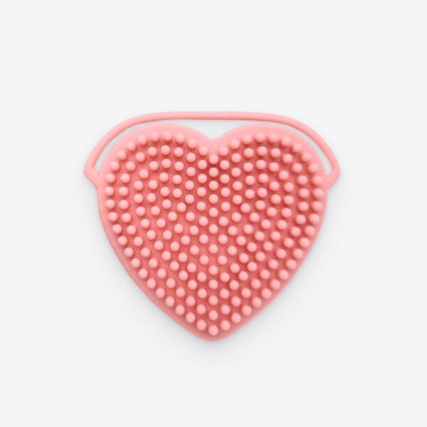 Heart-Shaped Brush Cleaning Tool for facial cleansing brushes.