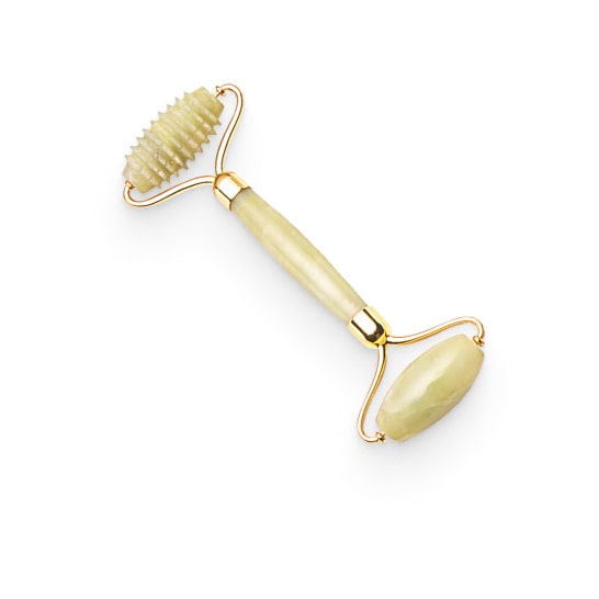 Facial roller on white background