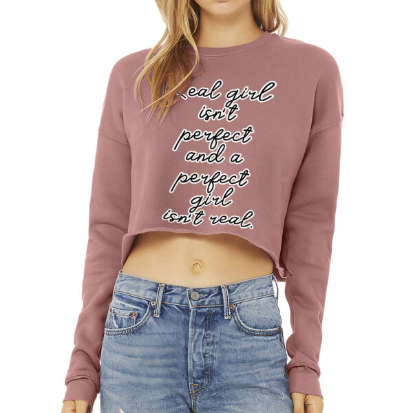 Cropped sweatshirt with "Real Girl Isn't Perfect" slogan in bold font.