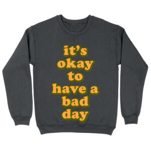 Sweatshirt with comforting "It's Ok" motivational statement.