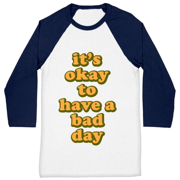 Baseball tee with comforting "It's Ok" motivational statement.