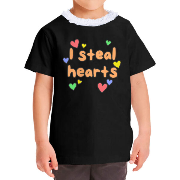 Girl wearing a cute "I Steal Hearts" ruffle neck t-shirt.