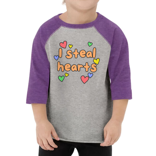 Adorable toddler wearing 'I Steal Hearts' baseball t-shirt.