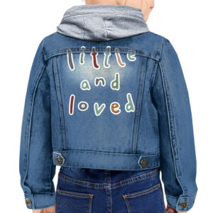 Trendy toddler wearing 'Little and Loved' hooded denim jacket.