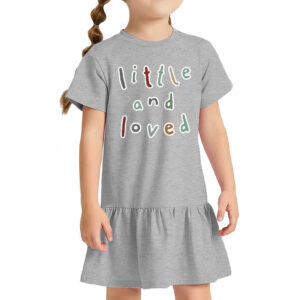 Toddler wearing a ribbed dress with "Little and Loved" print.