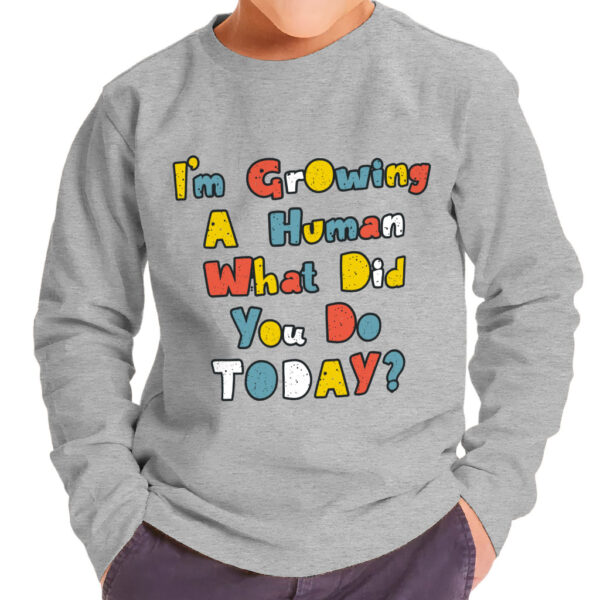 Image of "I'm Growing a Human" Toddler Long Sleeve T-Shirt - Vibrant and playful.