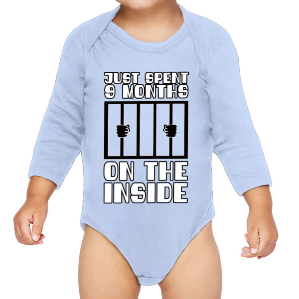 Baby wearing a cozy long sleeve onesie.