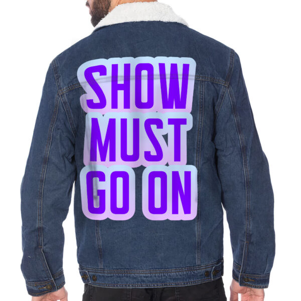 Man wearing a stylish sherpa-lined denim jacket with a humorous design.