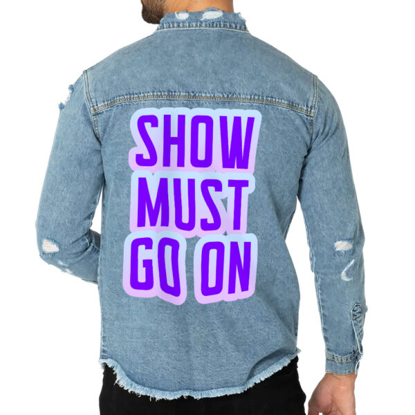 Front view of a man wearing a denim shirt with funny graphics.