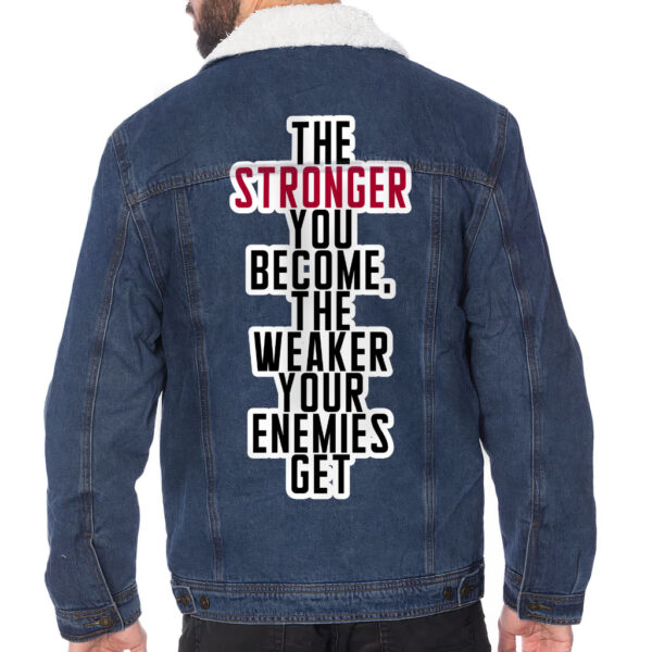 Front view of a man wearing a sherpa-lined denim jacket with motivational details.