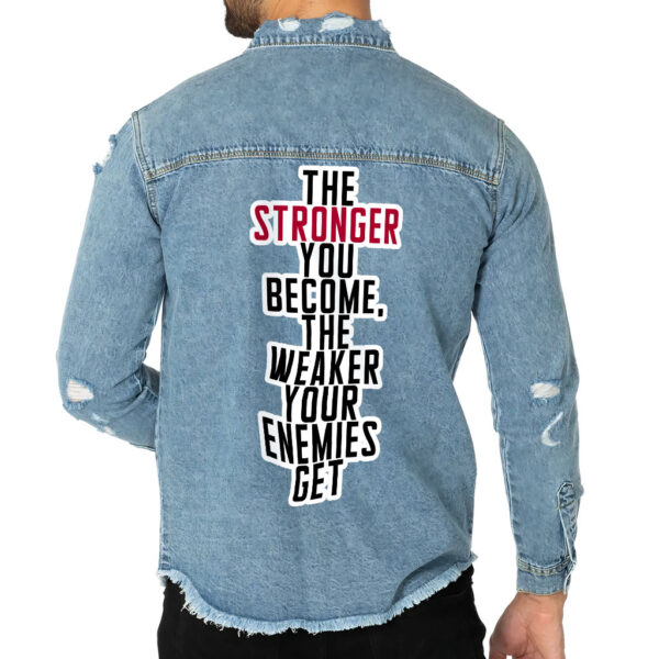 Front view of a man wearing a distressed denim shirt with motivational details.