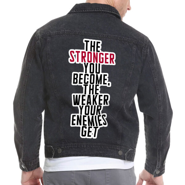 Front view of a man wearing a black vintage denim jacket with motivational details.