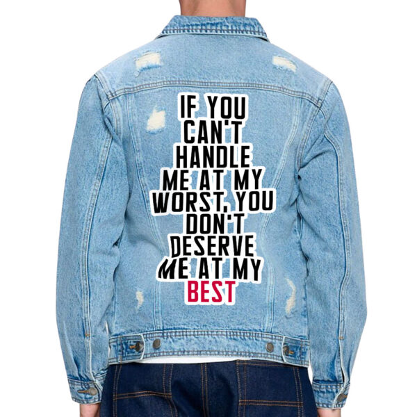 Front view of a man wearing a distressed denim jacket with cool sayings.