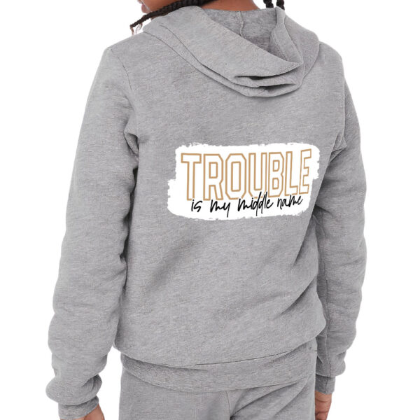 Kids' full-zip hoodie with trouble-themed design.